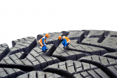 Little men checking tyre treads
