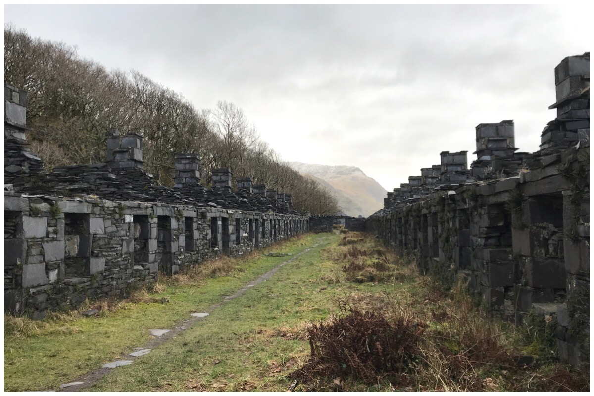 The ruins of Anglesey Barracks at Dinorwig Quarry. Two rows of quarrymen houses made of slate.