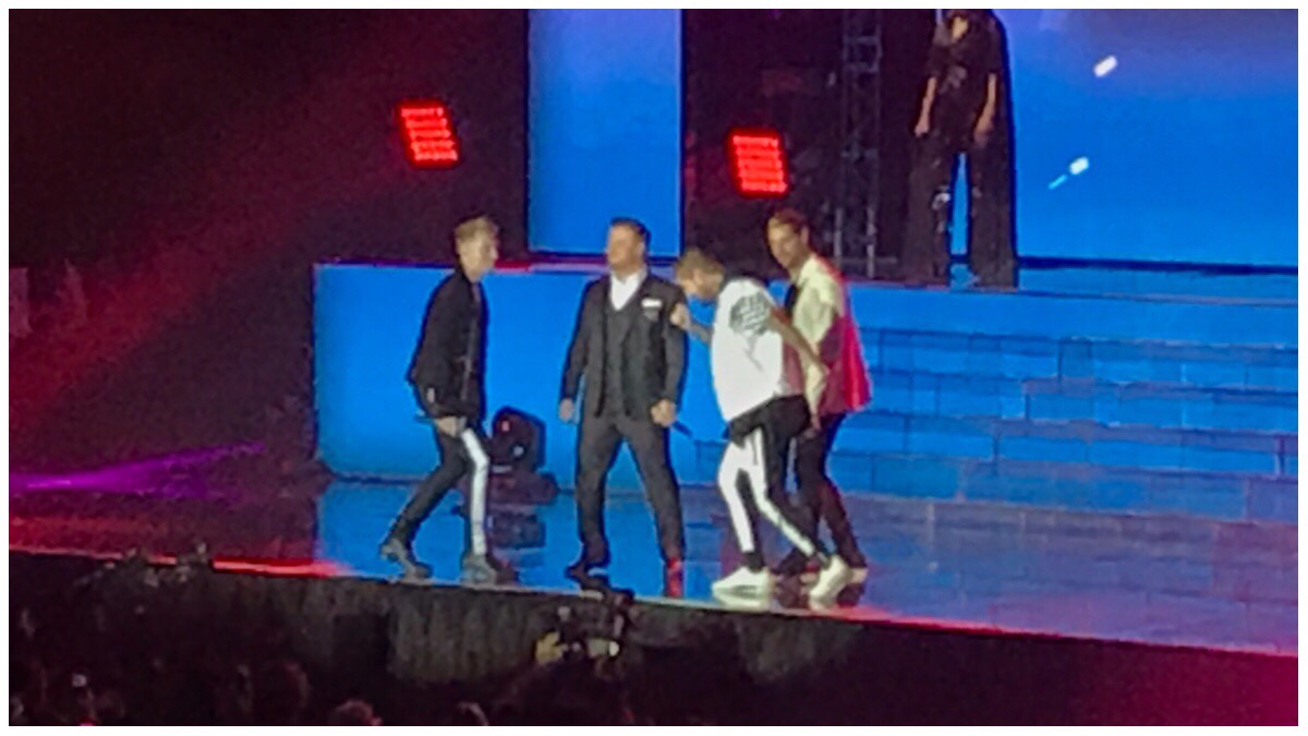 A rather blurry photo of Boyzone on stage - from left to right you have Ronan Keating, Mikey Graham, Shane Lynch and Keith Duffy