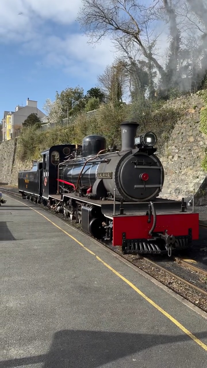 I find it quite amazing that I can see something like this when I run errands! 

Here’s about 4.5 minutes of the NG15 “Kalahari” at Y Stesion on the 40th March 2026.

The NG15 number 134 “Kalahari” is the latest addition to the Ffestiniog & Welsh Highland Railways fleet. She originally was 134 built in 1952 and worked on the Otavi Railway in Namibia, Africa. 

In 1960 it was regauged and transferred to Port Elizabeth to work on the Avontuur Branch, South Africa. She was withdrawn from service in 1990 for boiler work but it was never completed.

In 1998 she was bought by the FWHR for use on the Welsh Highland line. She was far too big to navigate the tight cuttings and tunnels on the Ffestiniog Railway line. 

It took up until 2024 for the rebuild to be completed and she made her steam debut at the Superpower Weekend in September of that year. 

After a few special appearances, she officially entered service in June 2025 hauling Gelert Explorer services. 

As it happens she had been hauling the Gelert Explorer services when I was filming this. 

#steamtrains #heritagerailways #snowdonia360 #caernarfon #ng15