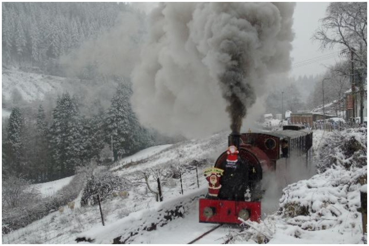 A Santa train chuffing through the snow on the Corris Railway