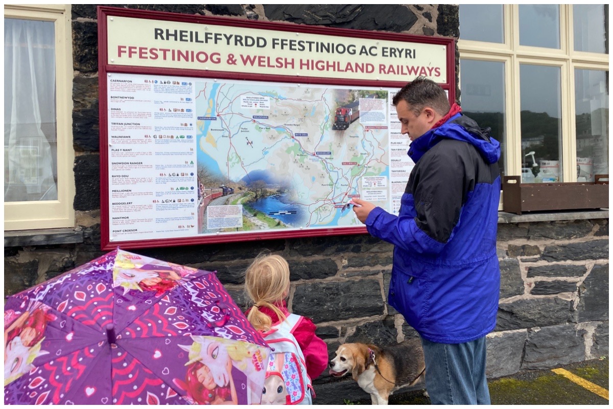 Husband and the littles looking at the map outside Ffestiniog Railway's Harbour Station