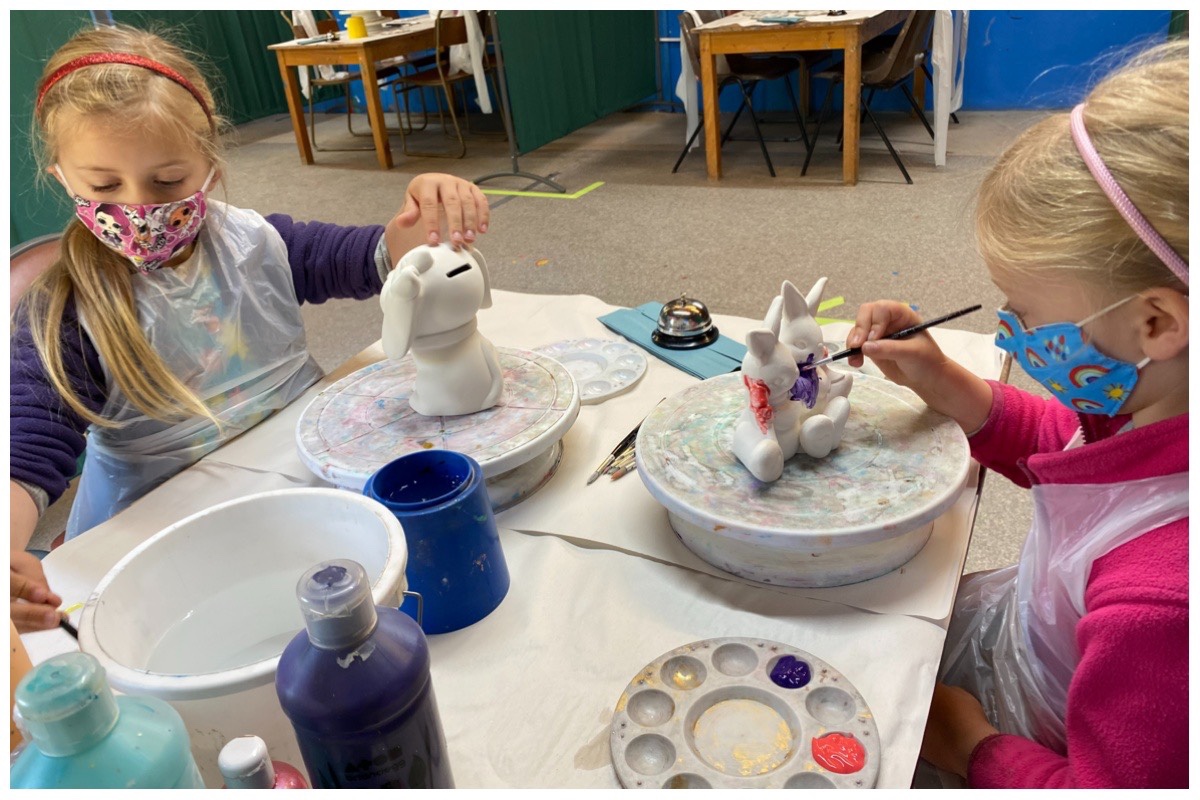 The girls painting at Piggery Pottery