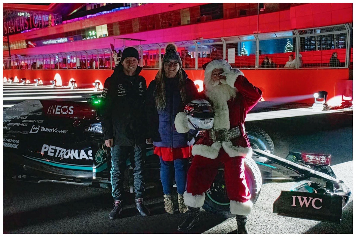 Rebecca with Ant Davidson, Santa and the Mercedes-AMG Petronas W10