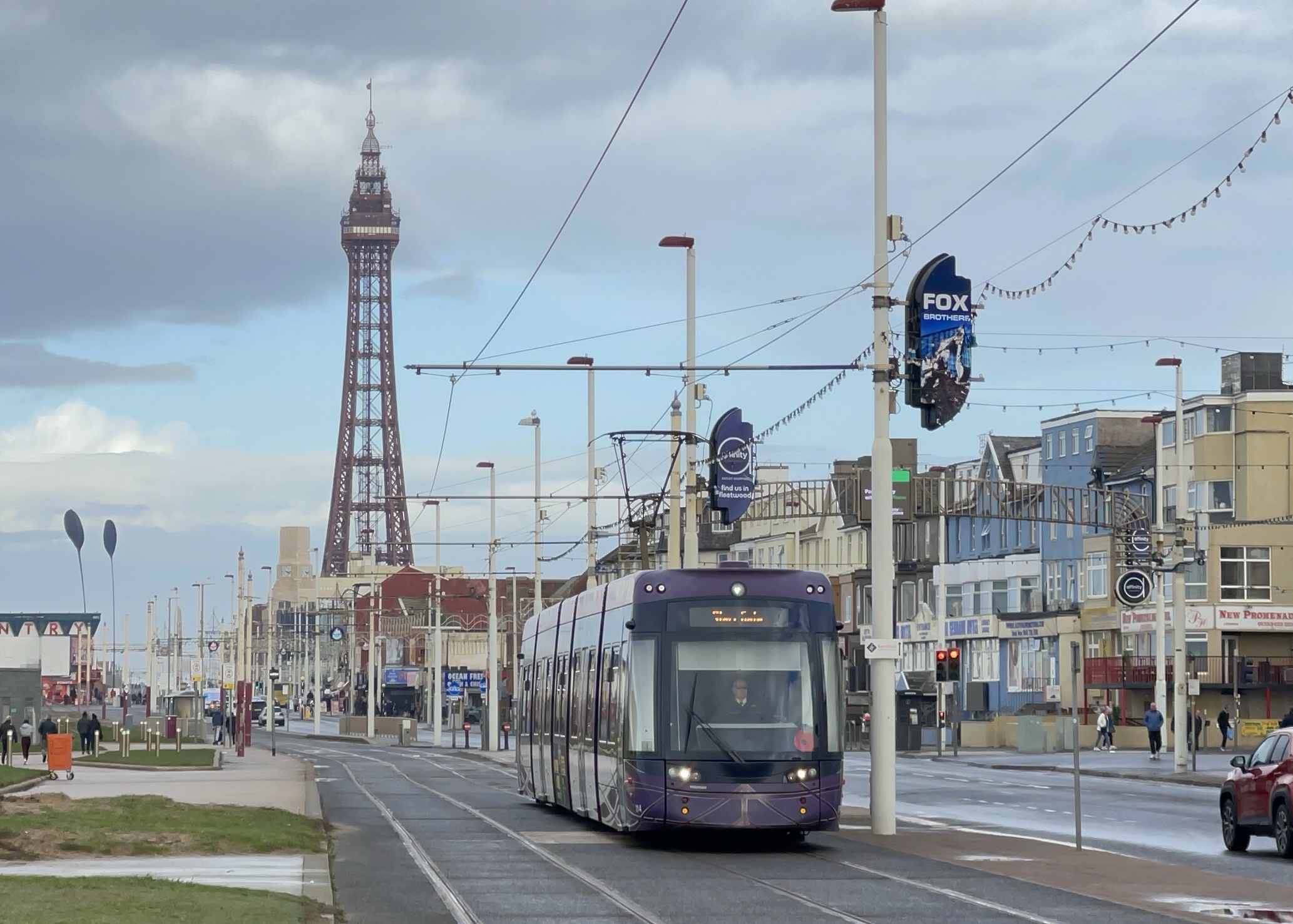 Blackpool Tower in the background with a tram in the foreground