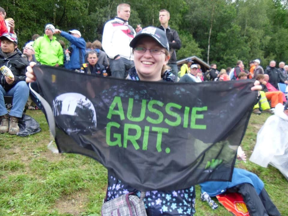 Rebecca with an Aussie Grit flag at Belgian Grand Prix
