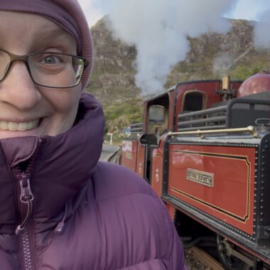 Rebecca selfie with David Lloyd George loco in the background during 2026 Victorian Weekend on the Ffestiniog Railway